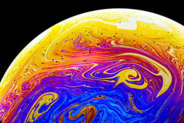 Wall Mural - multicolored rainbow colors of a single soap bubble that looks like a fantasy planet isolated agains