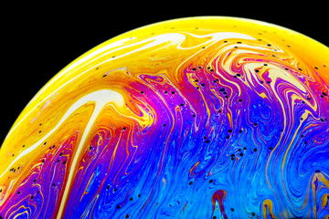 Wall Mural - multicolored rainbow colors of a single soap bubble that looks like a fantasy planet isolated agains