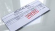 Medical bill past due, seal stamped on document, payment for services, insurance