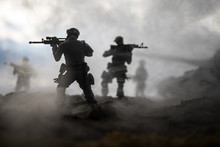 War Concept. Military Silhouettes Fighting Scene On War Fog Sky Background, World War Soldiers Silhouettes Below Cloudy Skyline At Sunset. Attack Scene. Armored Vehicles.