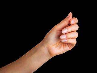 Wall Mural - Woman hand holding something with two fingers