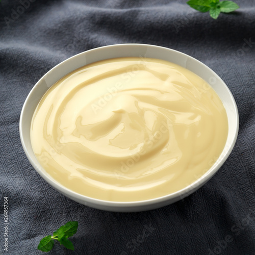Cuadros en Lienzo Bowl of vanilla custard on rustic background