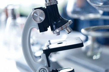 Wall Mural - close-up microscope for research tool anatomy of small organisms with metal lens at laboratory, biol