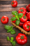 Fototapeta Kuchnia - Fresh ripe tomatoes and basil in the basket