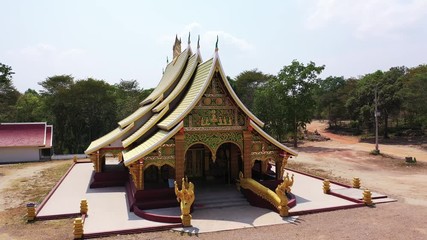 Wall Mural - Buddhist golden temple shooting by drone