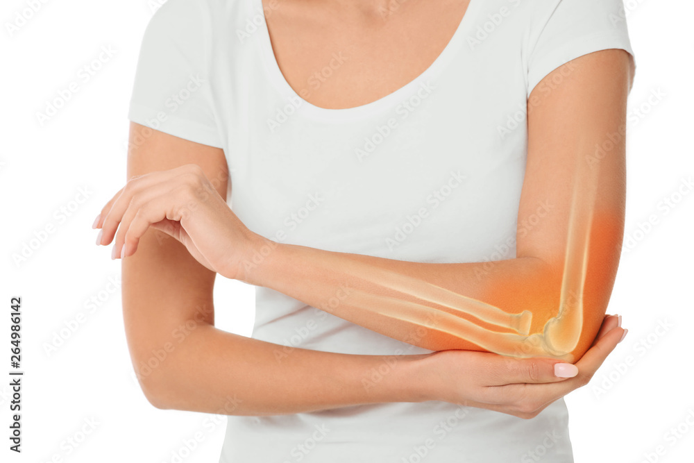 woman suffering pain in the elbow. Composite of image arm bones and elbow - obrazy, fototapety, plakaty 