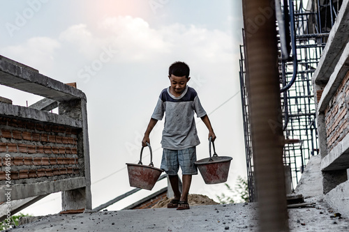 Cuadros en Lienzo Children working at construction site for world day against child labour concept