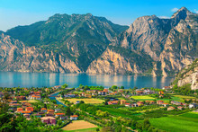 Fantastic Torbole Cityscape With Plantations And Lake Garda, Italy, Europe
