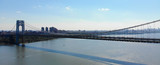 Aerial view of George Washington Bridge in Fort Lee, NJ. George Washington Bridge is a suspension bridge spanning the Hudson River connecting NJ to Manhattan, NY. Panorama of GWB during summer