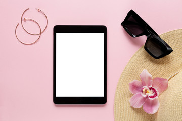 Travel background with accessories: woman hat, tablet, sunglasses, flower.. Vacation concept.