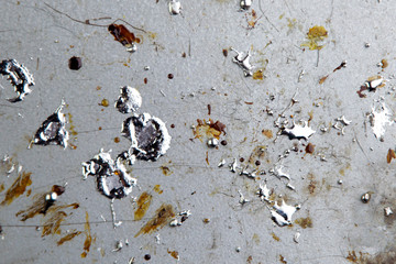 Wall Mural - drops of molten metal and rosin on a metal soldering board, selective focus, close