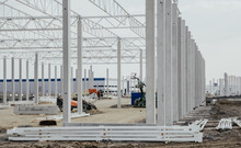 Concrete Poles For The Construction Of The Warehouse. Building A New Warehouse, Industrial Concept And Construction. Development And Modernity. Setting Stable Pillars For New Buildings.