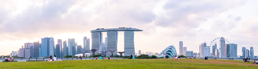 Poster - 2019 March 1st, Singapore, Marina Barrage - Panorama view of the city buildings and people doing their activities at sunset.