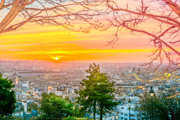 Wall Mural - Sunrise in Paris, France. Panorama of the city from the hill of Montmartre at sunny morning