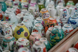 Fototapeta Paryż - Coloured ceramic cups placed upside down