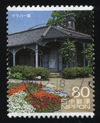 Poster - house surrounded with the flowerbeds