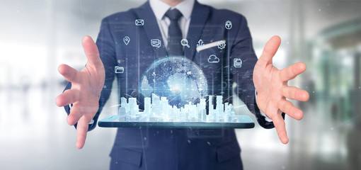Poster - Businessman holding Smart city user interface with icon, stats and data 3d rendering