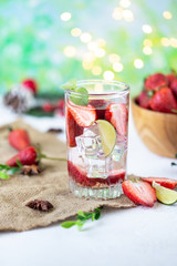 Wall Mural - healthy refreshing energy ice cold strawberries lemonade with lime