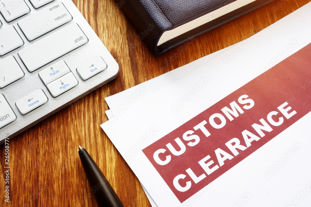 Customs clearance documents on an office table. - obrazy, fototapety, plakaty 