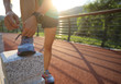 © lzf - Runner athlete tying shoelace on spring forest trail. woman fitness jogging workout wellness concept.