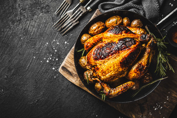 Wall Mural - Baked whole chicken with spices on pan