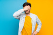 © luismolinero - Handsome over isolated colorful background covering eyes by hands. Do not want to see something