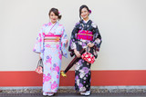 Fototapeta  - Japanese women with kimono walking in Tokyo