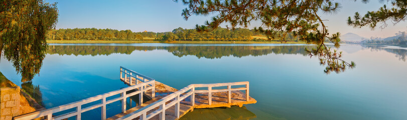 Wall Mural - sunrise over xuan huong lake, dalat, vietnam. panorama