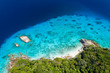 Aerial drone view of beautiful tropical islands with crystal clear waters and lush greenery (Similan Islands, Thailand)