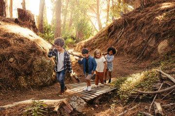 Poster - Group of children building camp in forest