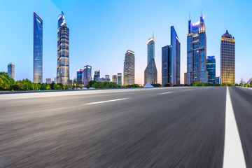 Motion blurred highway and skyline of modern urban buildings in Shanghai