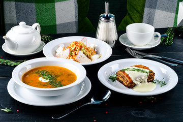 Poster - Enjoy your meal. Set of three delicious dishes served on a restaurant table