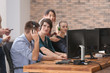 © Africa Studio - Young people playing video games at tournament