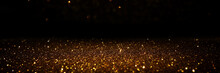 Glitter Vintage Lights Background. Black And Gold. De-focused