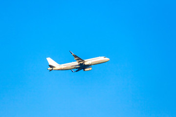 Passenger plane in the blue sky.