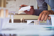 © Chaosamran_Studio - architect design working drawing sketch plans blueprints and making architectural construction model in architect studio