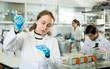 © JackF - Female chemist mixing reagents