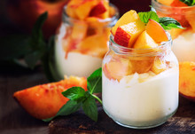 Dessert With Sweet Peaches, Cottage Cheese And Whipped Cream, Served In Glass Jars, Vintage Wooden Background, Selective Focus