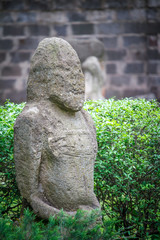 Ancient statue of Polovtsian stone woman or boundary stone in the city park