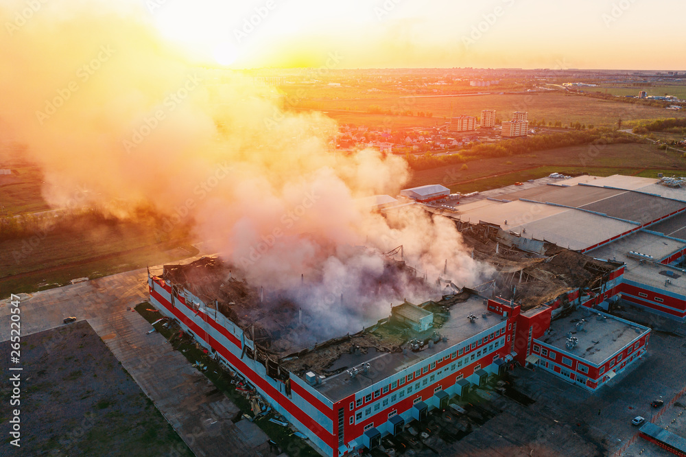 Heavy smoke in burning industrial warehouse or storehouse industrial ...