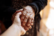 © Marcos Osorio/ADDICTIVE STOCK - Grandson holding his grandmother's hand