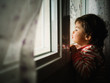 © Patricia Becaroto/ADDICTIVE STOCK - small girl peering through window at home