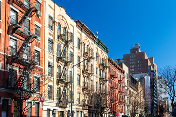 Wall Mural - Block of colorful old buildings with clear blue sky background in the Upper East Side of Manhattan in New York City