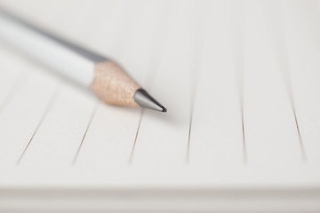 Poster - Gray pencil point to the empty area of note paper