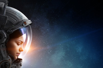 Wall Mural - female astronaut in space on planet orbit.