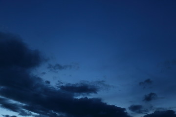 Wall Mural - black cloud on blue night sky
