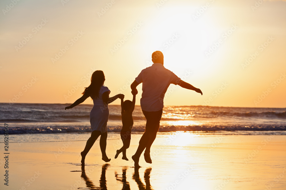 Happy family black silhouette on sun background. Father, mother, baby son run. Child jump with fun by water pool along sea surf on beach. Travel lifestyle, parents walking with kid on summer vacation. - obrazy, fototapety, plakaty 