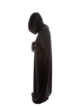 Monk Wearing Black Robes And A Hood Or A Person In A Halloween Costume Of A Grim Reaper Ghost.  The Image Depicts A Priest In Traditional Or Ancient Clothing.