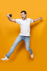 Canvas Print - Full length portrait of a happy young man