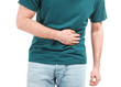 © Pixel-Shot - Young man suffering from stomachache on white background